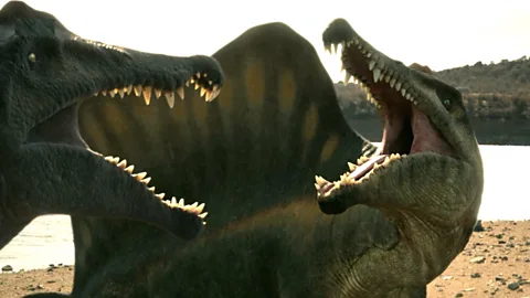 Watch Spinosaurus' fierce fight for food and survival